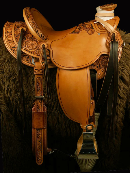 16 inch seat 94 degree bars Wade Saddle. 1/2 Sheridan style floral tooled, 7/8ths Stainless Steel rigging, cantle 5 inch high by 12 & 1/2 inch wide. Saddle hand built by Keith Valley.